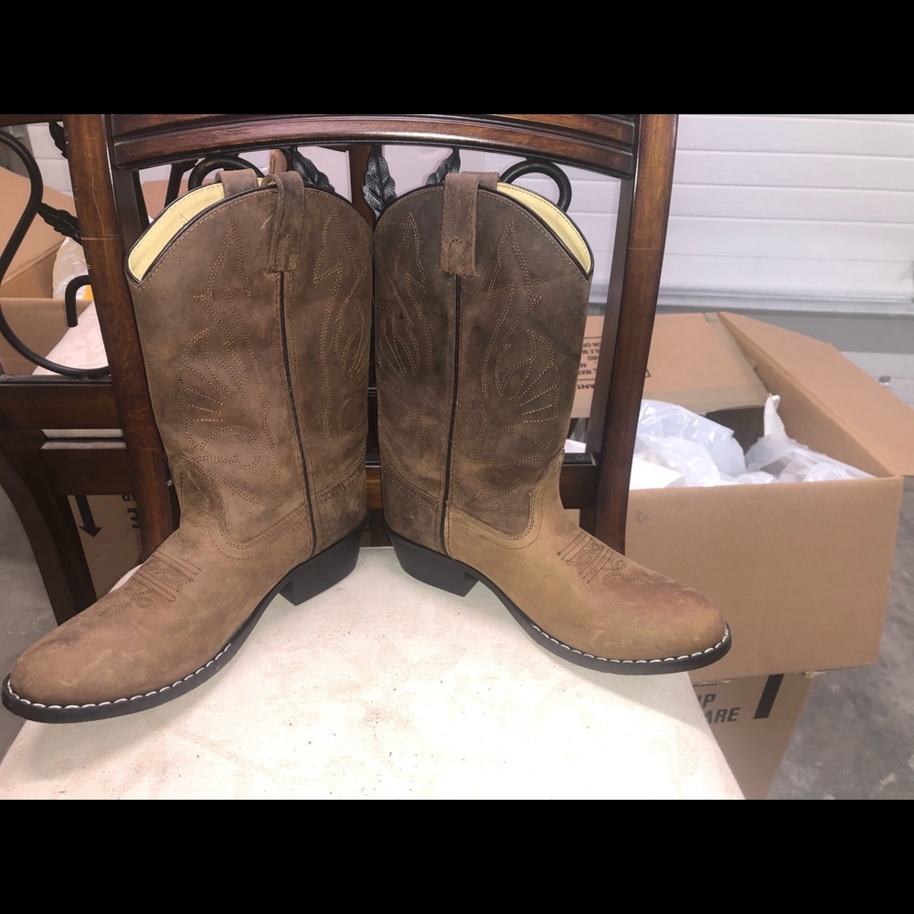 Lightly worn cowboy boots.